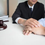 Mature male lawyer or notary with client deciding on marriage di